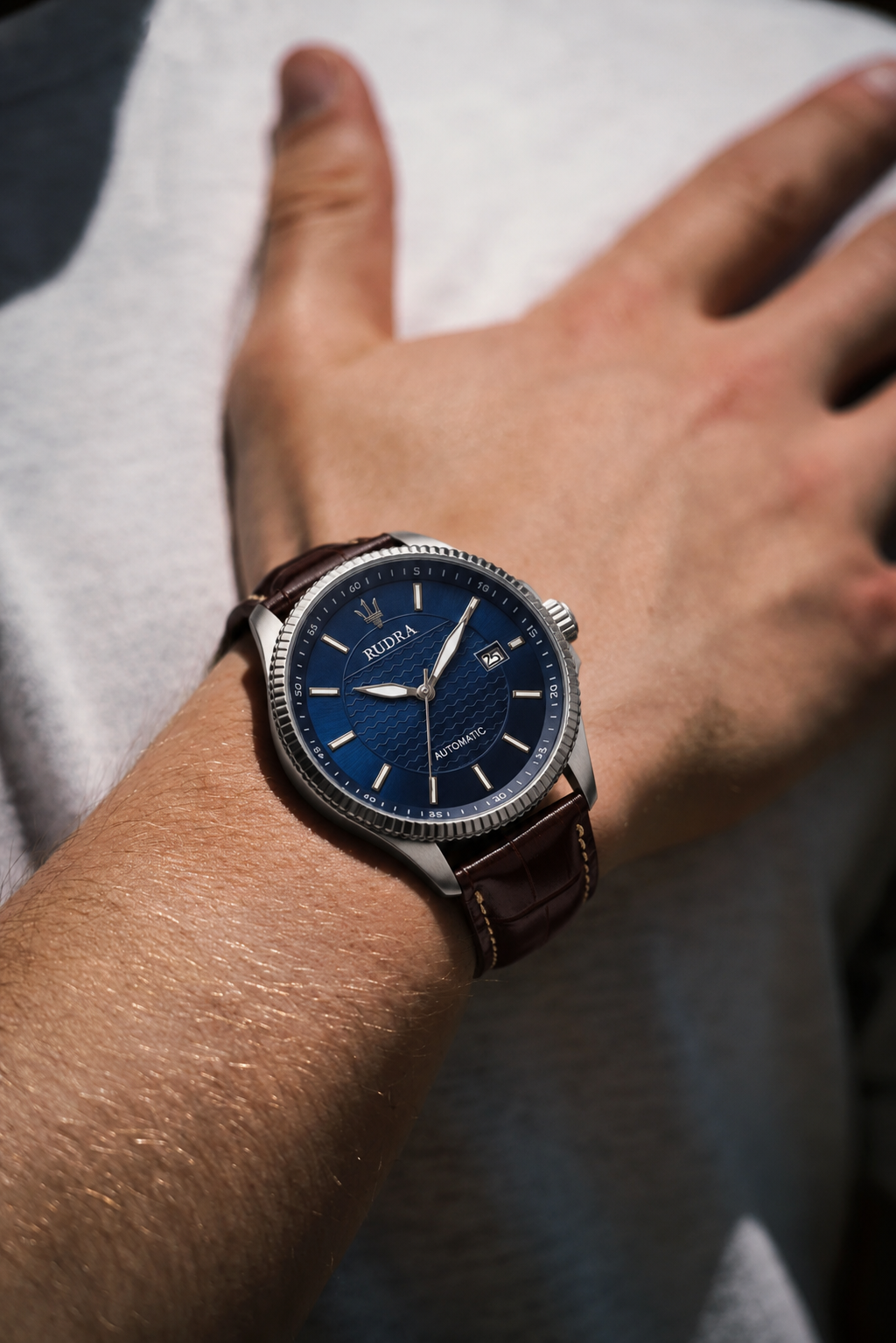 A meaningful watch being fastened onto a person's wrist.
